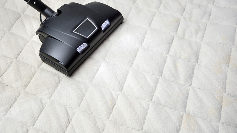 vacuuming stripped mattress