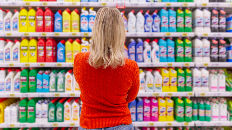 Woman standing in cleaning aisle