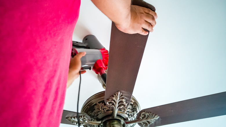 Vacuuming a ceiling fan