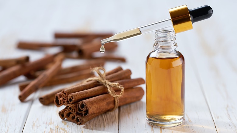 Cinnamon essential oil and sticks