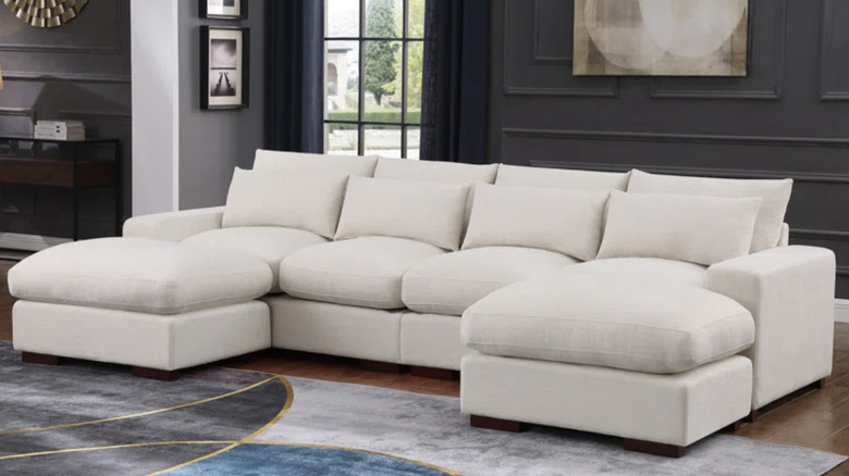 Nyrere Upholstered sofa in beige.