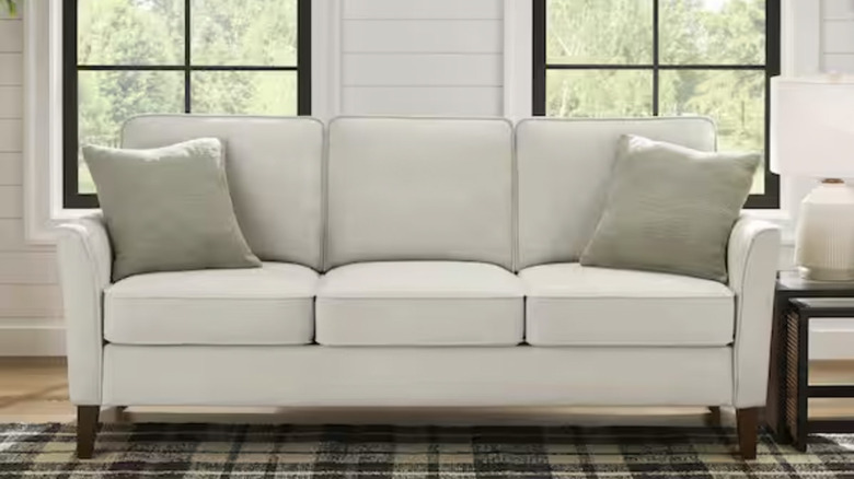 StyleWell Doherty three-seater beige couch.