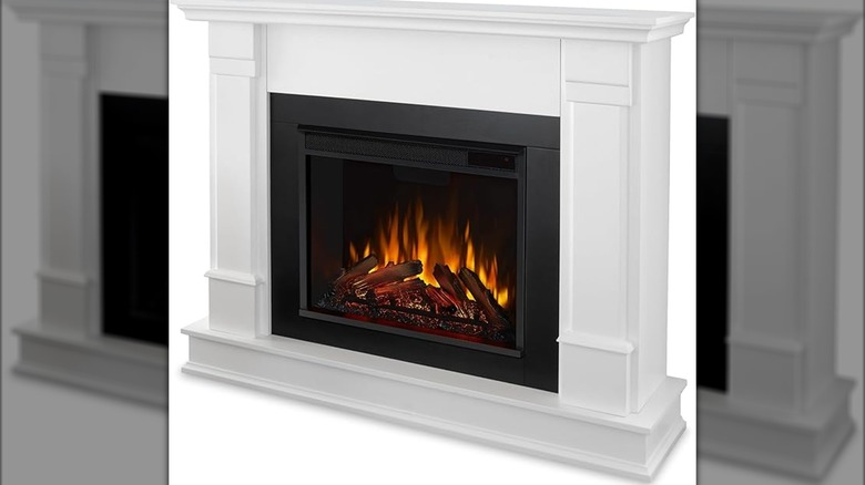 An electric indoor fireplace with a mantel