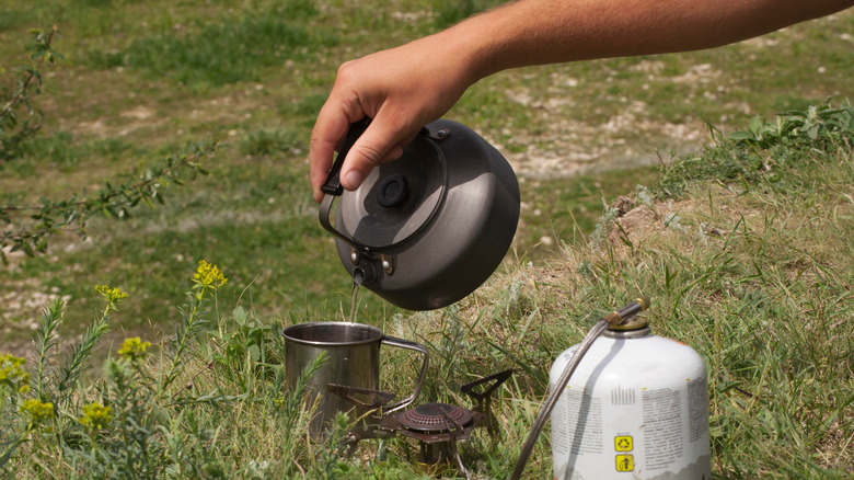 Pouring boiling water into cup