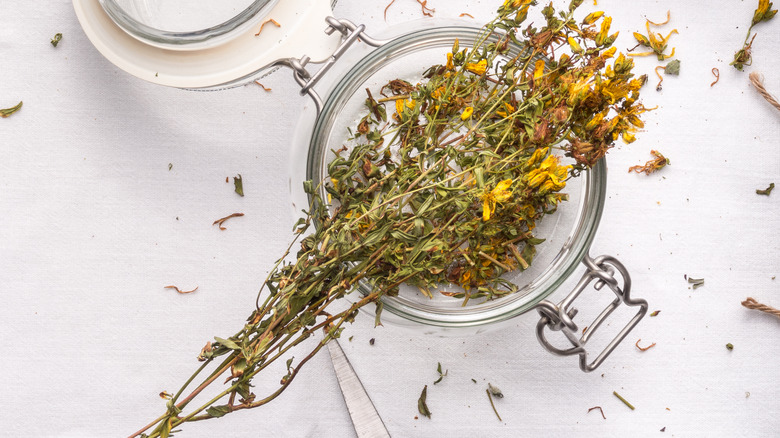 Open jar with dry herbs