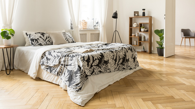 herringbone hardwood floor in bedroom