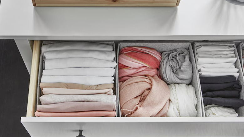 Clothes stored in KOMPLEMENT boxes that have been placed in a drawer.