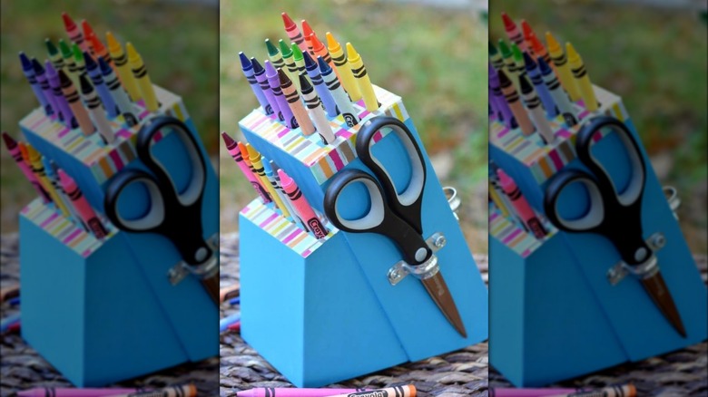 crayons in blue knife block