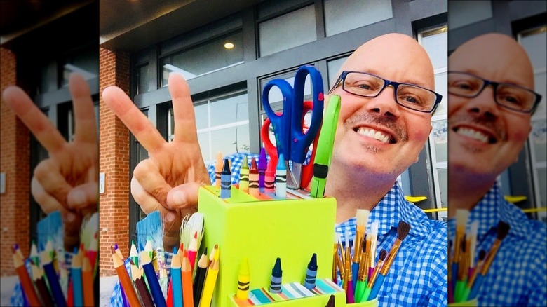 man holding green organizer