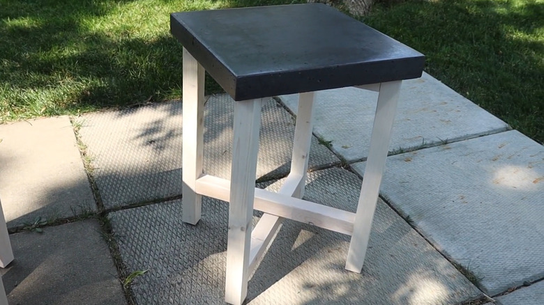 Paver side table with crossing legs