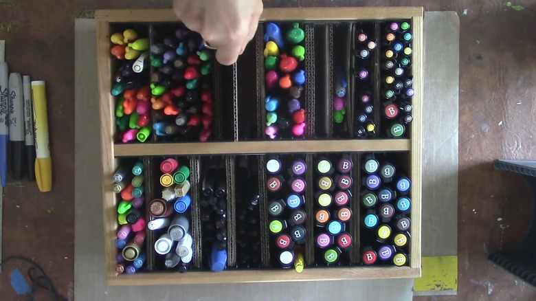 Art marker container made from old CD storage rack