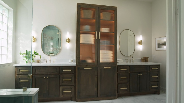 A modern vanity with a storage tower