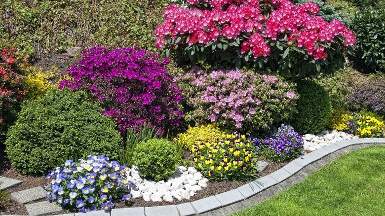 Smooth concrete pavers edging a flower bed