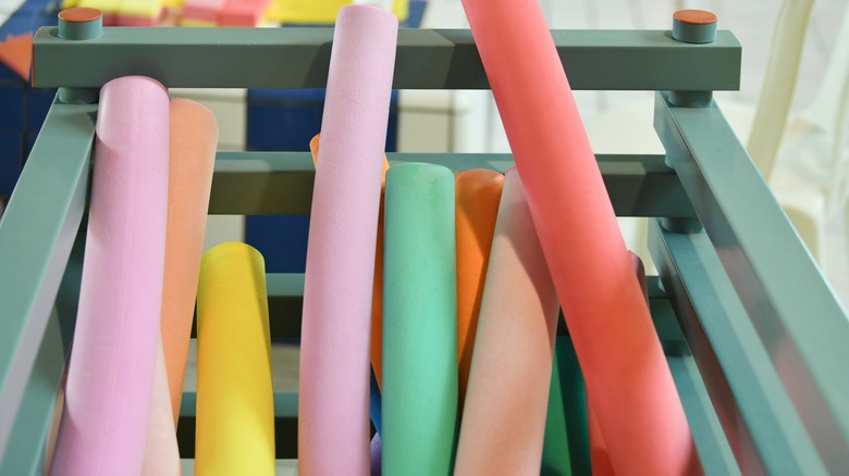 pool noodles in container