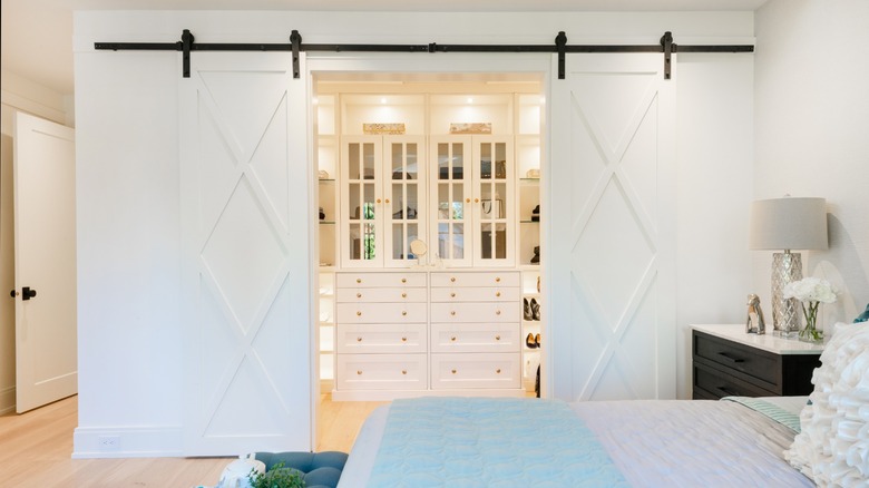 walk in closet with barn doors