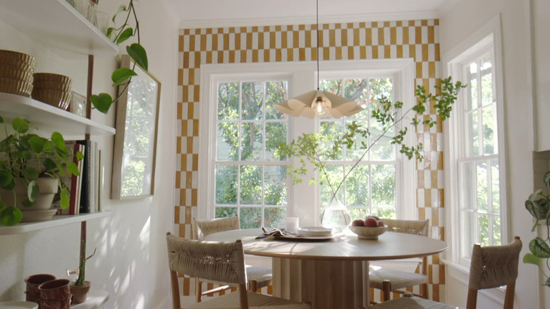 A tiled accent wall in a breakfast nook