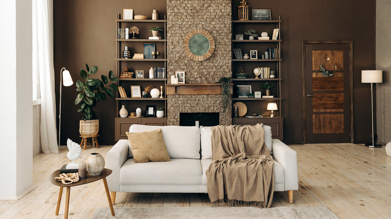 brown living room with dark fireplace