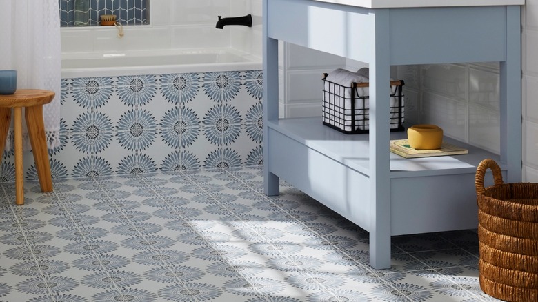 Bathroom with blue floral floor tiles