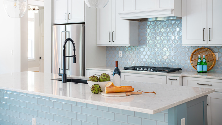 Glossy blue tile on kitchen island and backsplash