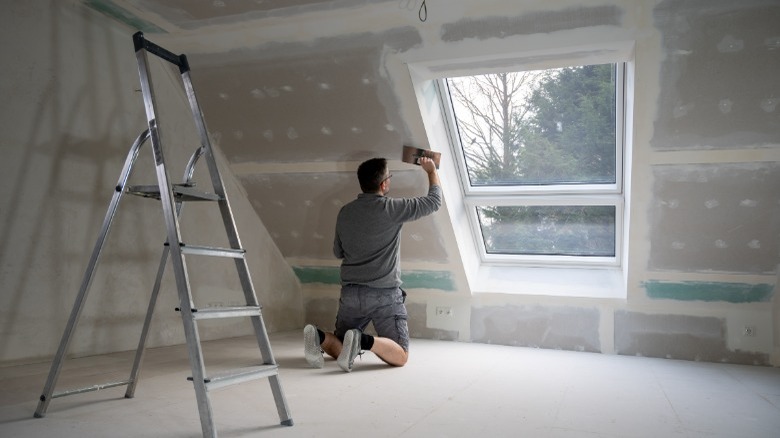 Man finishing an attic 