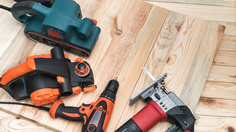 Power tools on a piece of wood