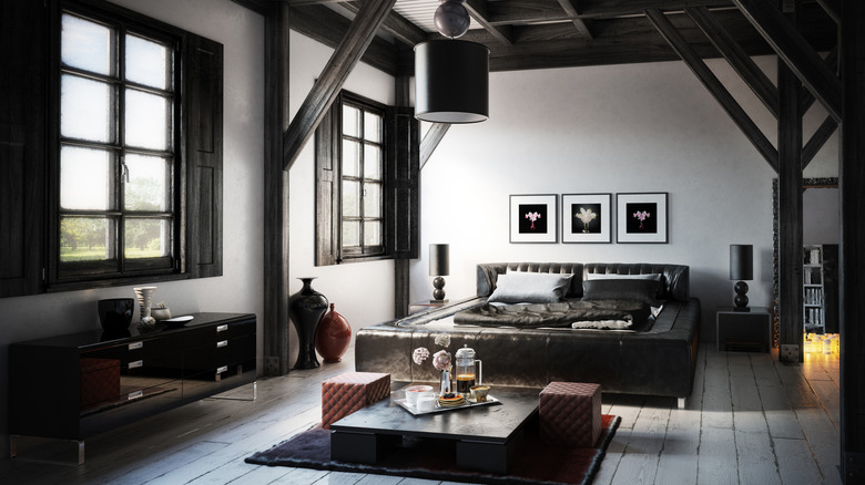 Bedroom with black woodwork and furniture