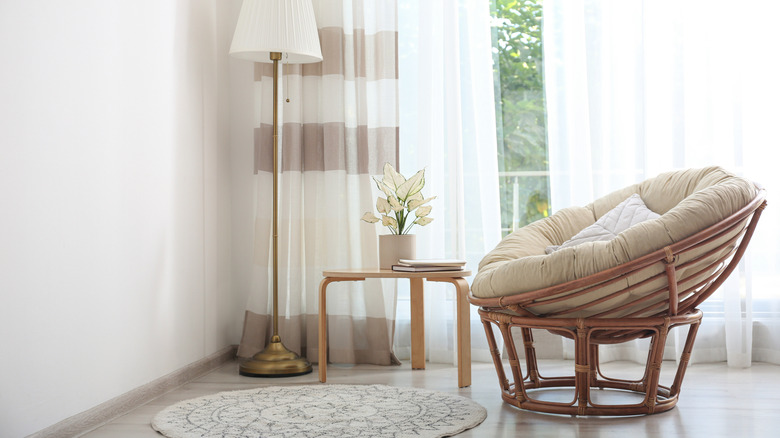 Papasan chair near window in living room