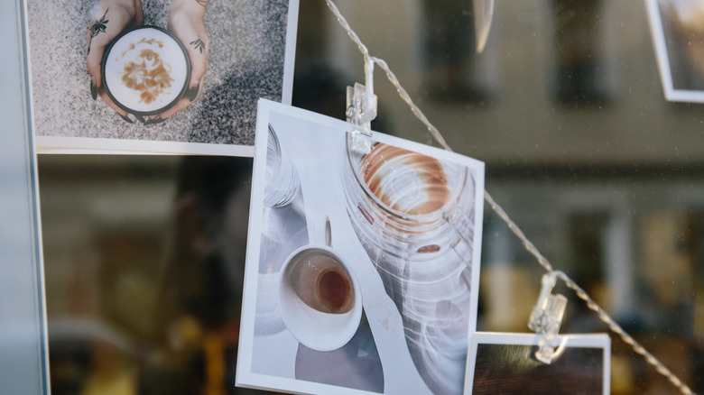 poloriod pictures hanging on a wire