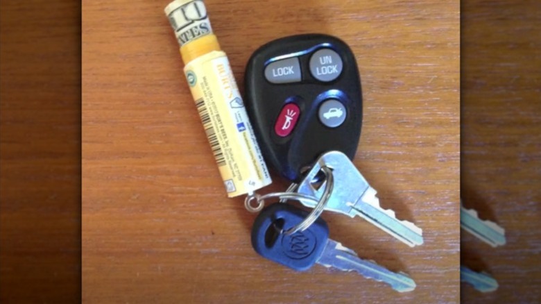 Old Chapstick container turned into a keyring to store money in.