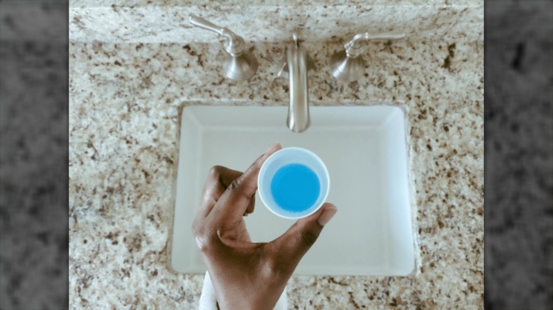 mouthwash cup over sink