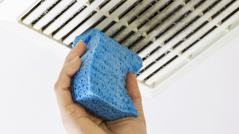 Cleaning air vent cover with a sponge