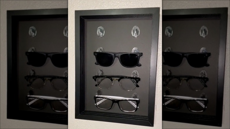 glasses hanging in black frame