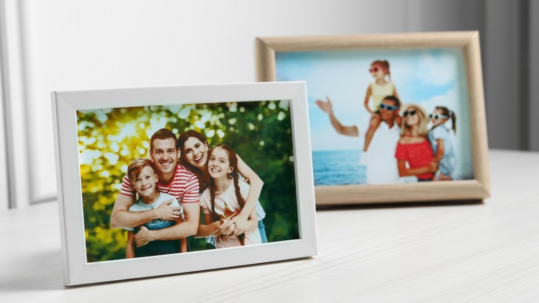 picture frames sitting on cabinet