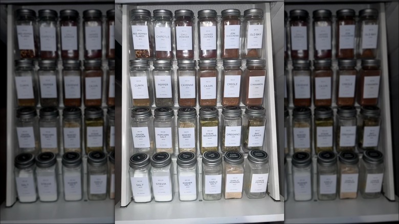 glass spice jars in drawer