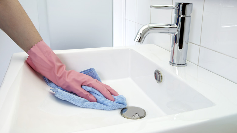 Hand cleaning bathroom sink