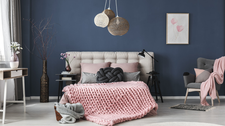 Bedroom with dark blue painted walls