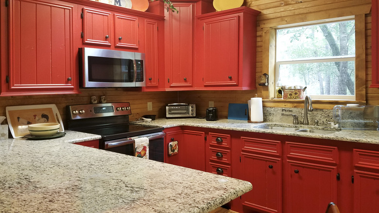 Kitchen with red cabinets