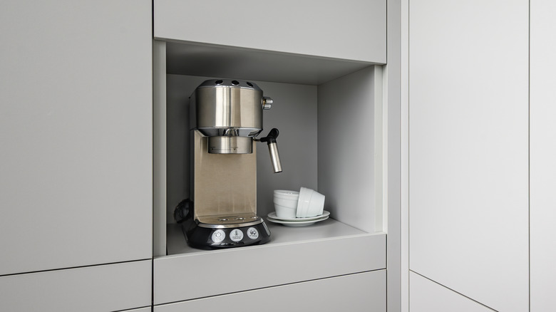 Coffee maker in grey cabinet