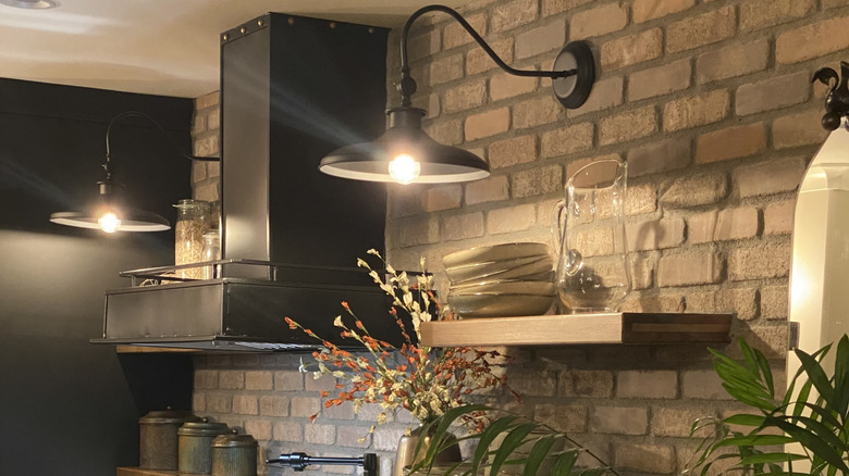 Lights above open shelves in kitchen