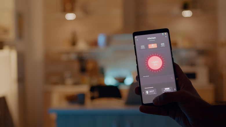 Hand controlling kitchen lights from a smartphone app