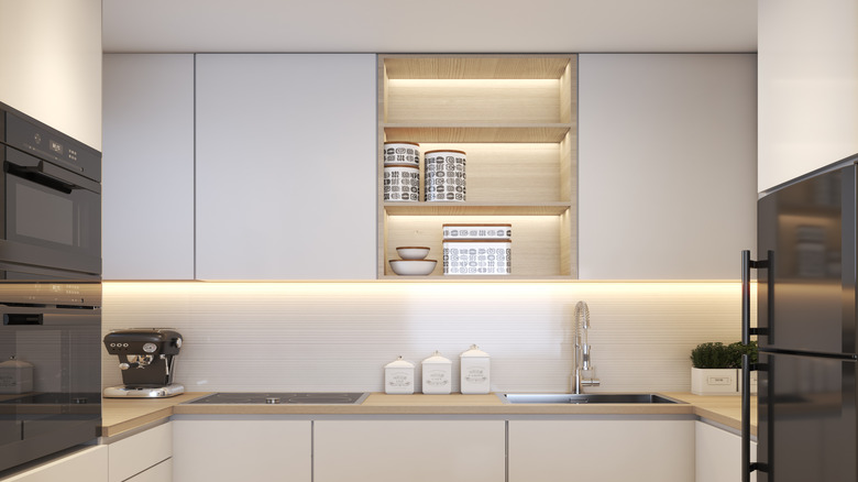 Under-lit kitchen cabinet with open shelving