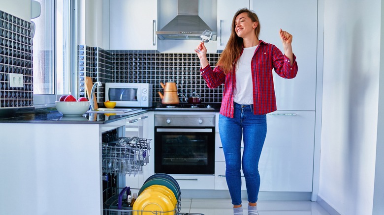 Woman happy with her dishwasher