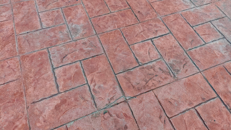 red stamped concrete in grand ashlar pattern