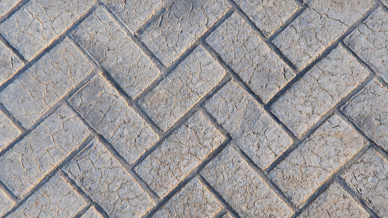 close up of herringbone pattern in stamped concrete