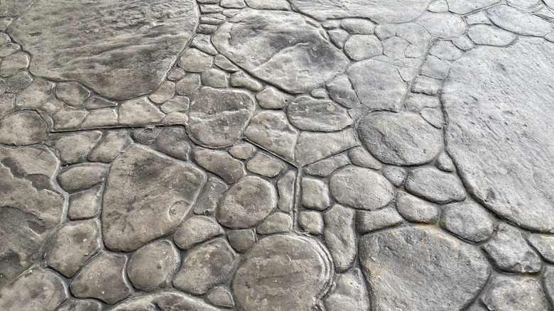 a close up of random stone patterned stamped concrete