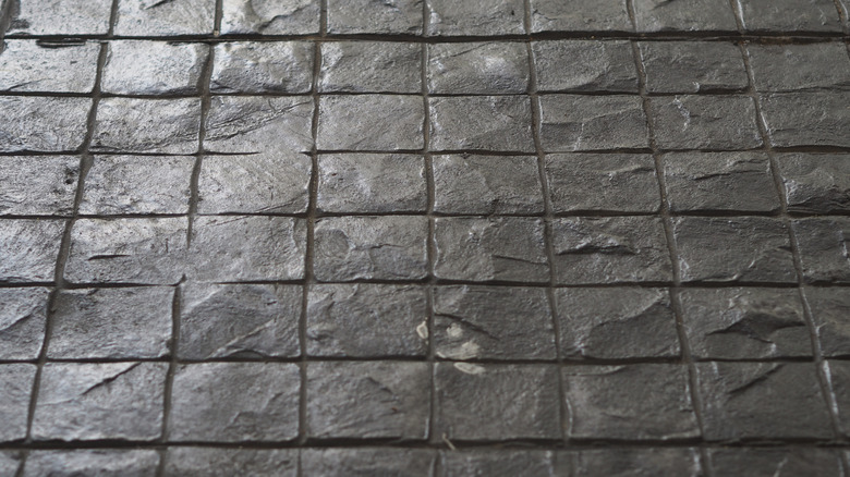 close up of square tiled patterned stamped concrete