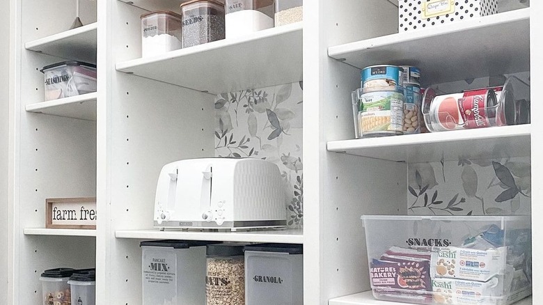 Blue and white wallpaper and canisters