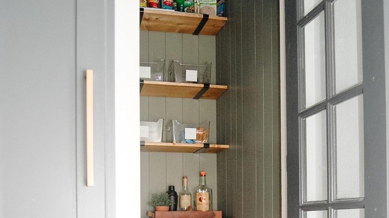 Pantry with green painted walls 
