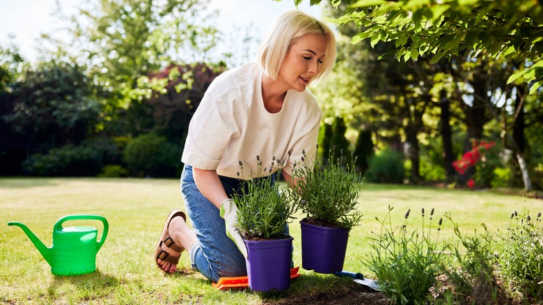 gardening woman kneeling on pad