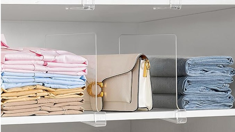 clear shelf dividers keeping items organized on closet shelf